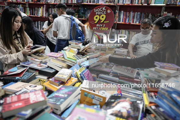 Visitors check discounted books at the Book Expo Thailand 2024 in Bangkok, Thailand, on October 12, 2024. The Book Expo Thailand 2024 takes...