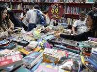 Visitors check discounted books at the Book Expo Thailand 2024 in Bangkok, Thailand, on October 12, 2024. The Book Expo Thailand 2024 takes...