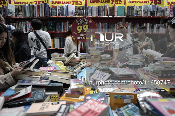 Visitors check discounted books at the Book Expo Thailand 2024 in Bangkok, Thailand, on October 12, 2024. The Book Expo Thailand 2024 takes...