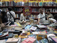 Visitors check discounted books at the Book Expo Thailand 2024 in Bangkok, Thailand, on October 12, 2024. The Book Expo Thailand 2024 takes...