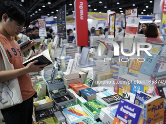 Visitors check books on display during the Book Expo Thailand 2024 in Bangkok, Thailand, on October 12, 2024. The Book Expo Thailand 2024 ta...