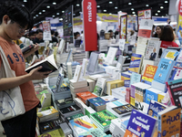 Visitors check books on display during the Book Expo Thailand 2024 in Bangkok, Thailand, on October 12, 2024. The Book Expo Thailand 2024 ta...