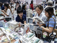 Visitors check books on display during the Book Expo Thailand 2024 in Bangkok, Thailand, on October 12, 2024. The Book Expo Thailand 2024 ta...