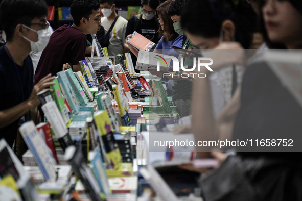 Visitors check books on display during the Book Expo Thailand 2024 in Bangkok, Thailand, on October 12, 2024. The Book Expo Thailand 2024 ta...