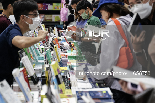 Visitors check books on display during the Book Expo Thailand 2024 in Bangkok, Thailand, on October 12, 2024. The Book Expo Thailand 2024 ta...