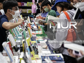 Visitors check books on display during the Book Expo Thailand 2024 in Bangkok, Thailand, on October 12, 2024. The Book Expo Thailand 2024 ta...