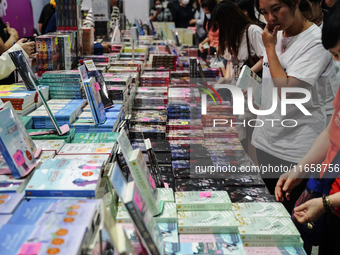 Visitors check books on display during the Book Expo Thailand 2024 in Bangkok, Thailand, on October 12, 2024. The Book Expo Thailand 2024 ta...