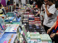 Visitors check books on display during the Book Expo Thailand 2024 in Bangkok, Thailand, on October 12, 2024. The Book Expo Thailand 2024 ta...