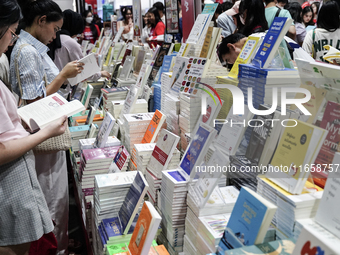 Visitors check books on display during the Book Expo Thailand 2024 in Bangkok, Thailand, on October 12, 2024. The Book Expo Thailand 2024 ta...