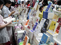 Visitors check books on display during the Book Expo Thailand 2024 in Bangkok, Thailand, on October 12, 2024. The Book Expo Thailand 2024 ta...