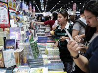 Visitors check books on display during the Book Expo Thailand 2024 in Bangkok, Thailand, on October 12, 2024. The Book Expo Thailand 2024 ta...