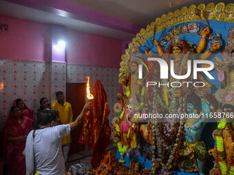 A priest worships an idol of goddess Durga on the last day of the Durga Puja festival in Kolkata, India, on October 12, 2024. (