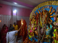 A priest worships an idol of goddess Durga on the last day of the Durga Puja festival in Kolkata, India, on October 12, 2024. (