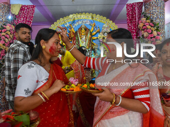 Married females smear each other with vermillion during a ritual called the vermillion game or ''Sindur Khela'' during the last day of the D...