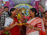 Married females smear each other with vermillion during a ritual called the vermillion game or ''Sindur Khela'' during the last day of the D...