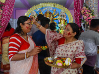 Married females smear each other with vermillion during a ritual called the vermillion game or ''Sindur Khela'' during the last day of the D...