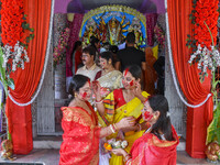 Married females smear each other with vermillion during a ritual called the vermillion game or ''Sindur Khela'' during the last day of the D...