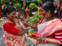 Married females smear each other with vermillion during a ritual called the vermillion game or ''Sindur Khela'' during the last day of the D...