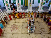 Married women offer their prayers for the last time to goddess Durga and immerse themselves in the ritual of ''Sindur Khela'' or vermillion...