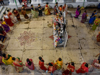 Married women offer their prayers for the last time to goddess Durga and immerse themselves in the ritual of ''Sindur Khela'' or vermillion...