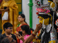 Married women offer their prayers for the last time to goddess Durga and immerse themselves in the ritual of ''Sindur Khela'' or vermillion...