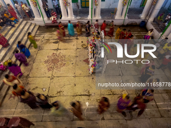 Married women offer their prayers for the last time to goddess Durga and immerse themselves in the ritual of ''Sindur Khela'' or vermillion...