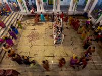 Married women offer their prayers for the last time to goddess Durga and immerse themselves in the ritual of ''Sindur Khela'' or vermillion...