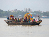 An idol of Goddess Durga is ferried to the middle of the river Ganges for immersion on the last day of the Durga Puja festival in Kolkata, I...