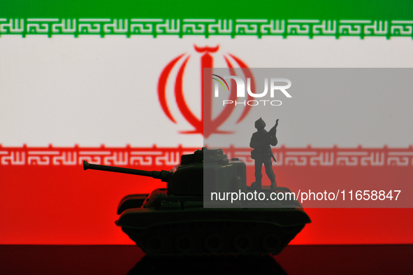 Illustration with figures of a soldier and a tank in front of an Iran flag displayed on a computer screen is seen in L'Aquila, Italy, on Oct...