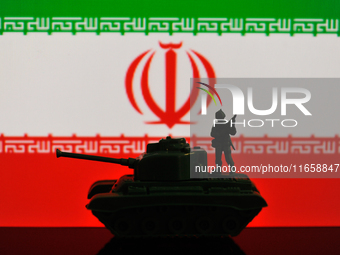 Illustration with figures of a soldier and a tank in front of an Iran flag displayed on a computer screen is seen in L'Aquila, Italy, on Oct...