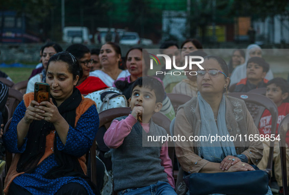 Hindu devotees look at the effigies of the mythic demon king Ravana, his son Meghnath, and brother Kumbhkaran on the occasion of the Hindu f...