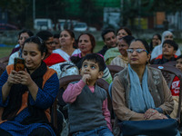 Hindu devotees look at the effigies of the mythic demon king Ravana, his son Meghnath, and brother Kumbhkaran on the occasion of the Hindu f...