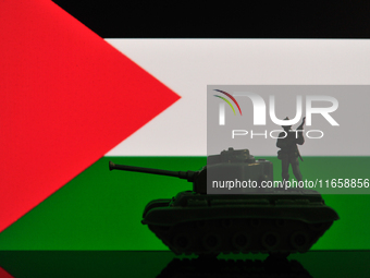 Illustration with figures of a soldier and a tank in front of a Palestine flag displayed on a computer screen is seen in L'Aquila, Italy, on...