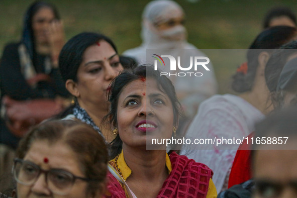 A Hindu devotee looks at the effigies of the mythic demon king Ravana, his son Meghnath, and brother Kumbhkaran on the occasion of the Hindu...