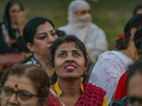 A Hindu devotee looks at the effigies of the mythic demon king Ravana, his son Meghnath, and brother Kumbhkaran on the occasion of the Hindu...