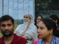 A Hindu devotee looks at the effigies of the mythic demon king Ravana, his son Meghnath, and brother Kumbhkaran on the occasion of the Hindu...