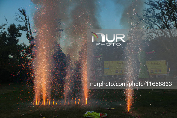 Firecrackers are burst on the occasion of the Hindu festival of Dussehra, which marks the triumph of good over evil, in Srinagar, Jammu and...