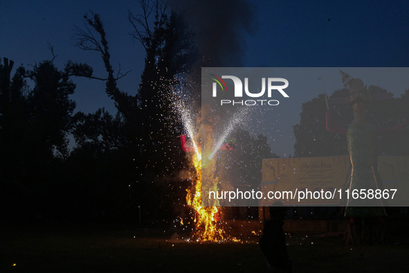 Fireworks explode as an effigy of Meghnad, son of demon king Ravana, burns on the occasion of the Hindu festival of Dussehra, which marks th...