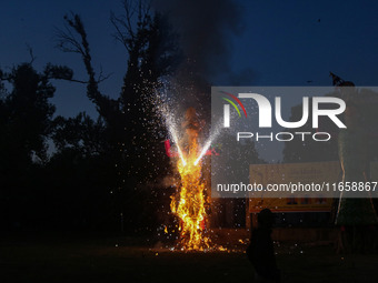 Fireworks explode as an effigy of Meghnad, son of demon king Ravana, burns on the occasion of the Hindu festival of Dussehra, which marks th...