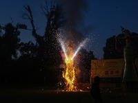 Fireworks explode as an effigy of Meghnad, son of demon king Ravana, burns on the occasion of the Hindu festival of Dussehra, which marks th...