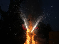 Fireworks explode as an effigy of Meghnad, son of demon king Ravana, burns on the occasion of the Hindu festival of Dussehra, which marks th...