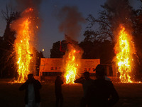 Effigies of the mythic demon king Ravana, his son Meghnath, and brother Kumbhkaran burn on the occasion of the Hindu festival of Dussehra, w...