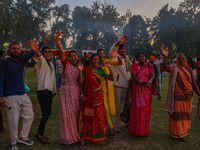 Hindu devotees dance as effigies of the mythic demon king Ravana, his son Meghnath, and brother Kumbhkaran burn on the occasion of the Hindu...