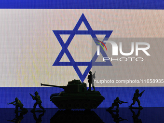 Illustration with figures of soldiers and a tank in front of an Israel flag displayed on a computer screen is seen in L'Aquila, Italy, on Oc...