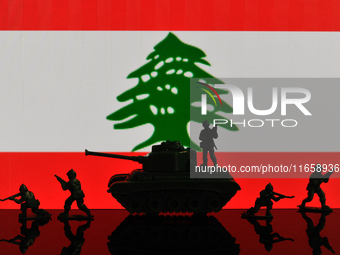 Illustration with figures of soldiers and a tank in front of a Lebanon flag displayed on a computer screen is seen in L'Aquila, Italy, on Oc...