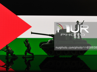 Illustration with figures of soldiers and a tank in front of a Palestine flag displayed on a computer screen is seen in L'Aquila, Italy, on...