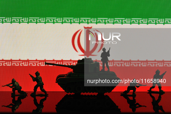 Illustration with figures of soldiers and a tank in front of an Iran flag displayed on a computer screen is seen in L'Aquila, Italy, on Octo...