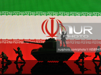 Illustration with figures of soldiers and a tank in front of an Iran flag displayed on a computer screen is seen in L'Aquila, Italy, on Octo...