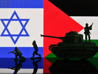 Illustration with figures of soldiers and a tank in front of Israel and Palestine flags displayed on a computer screen is seen in L'Aquila,...