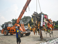 KMC workers clean the banks of the Ganges River on the last day of the Durga Puja festival in Kolkata, India, on October 12, 2024. (